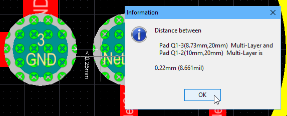 Measuring the distance between the edges of adjacent pads, using the Measure Primitives command.